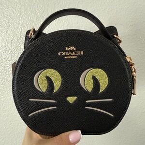 Coach Black Cat Face Round Bag with Gold Accents